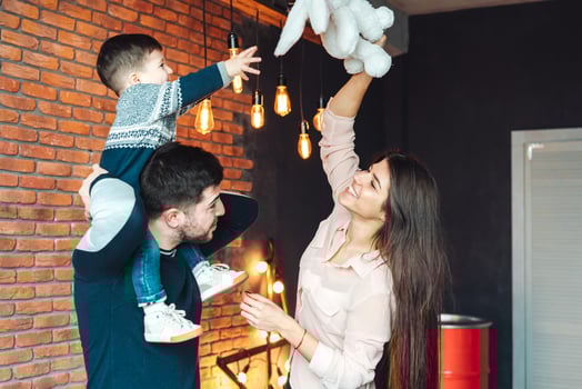 young family having fun at home photo