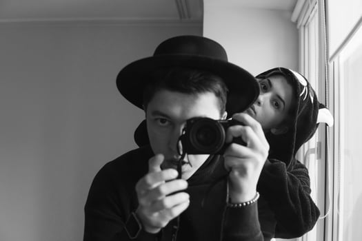 man and woman in black clothes photo