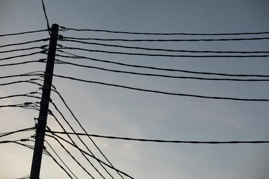 Wires against sky. Lots of electrical wires. photo