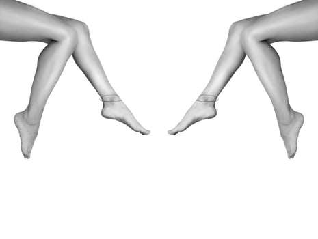 Two beautiful, smooth women's legs after laser hair removal. Treatment, technology concept photo