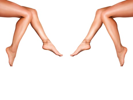 Beautiful smooth woman's legs after laser hair removal on the white background. Treatment, technology concept photo