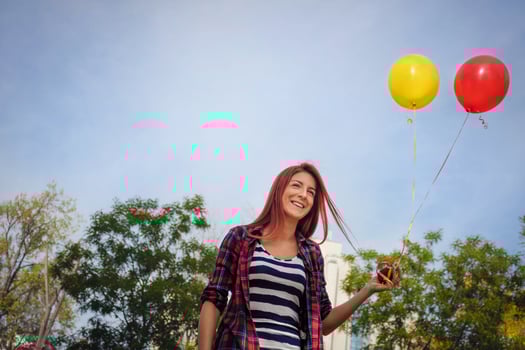 Happy woman with colorful balloons. photo