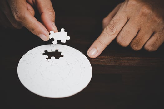Business woman person hand with puzzle piece idea for strategy and solution. Closeup part of two white jigsaw connect together. Concept of join cooperation success teamwork-problem corporate team. photo