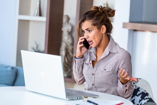 Confused angry customer calling support service at office. photo