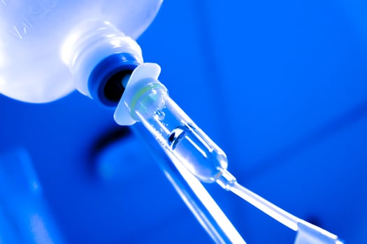Close up IV saline solution drip for patient hospital. photo
