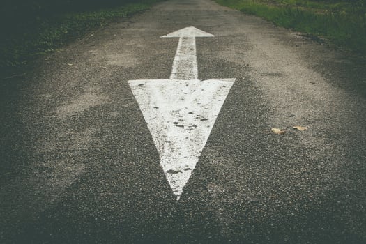 Arrows up and down drawn on the road photo
