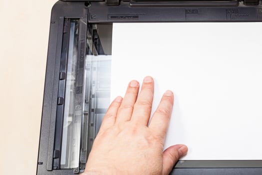 top view of putting of paper on glass of scanner photo