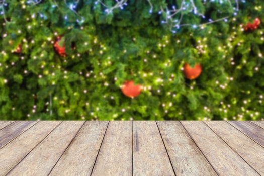 wood floor with decorations on the Christmas tree photo
