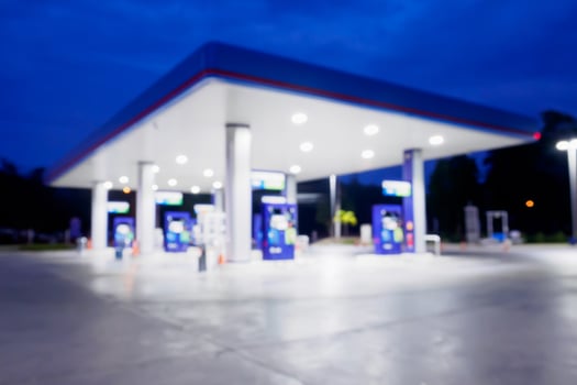 Blur Gas station at night time for background photo