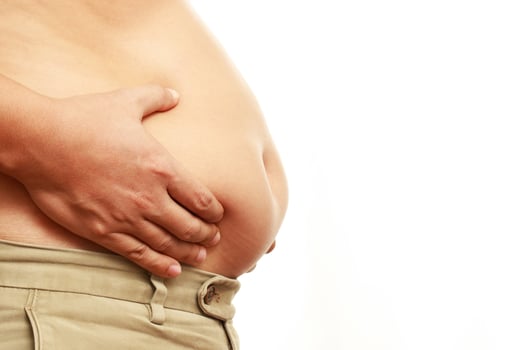 fat mature man check out body overweight abdomen his belly for white or obesity background. Weight loss concept. photo