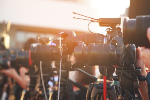 media photographer with entertainment reporters Interviewing celebrities and actors at a fashion show photo