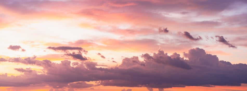 Beautiful dramatic and colorful sky at sunset over the mountains photo
