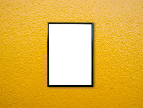 poster frame on yellow paint wall background photo