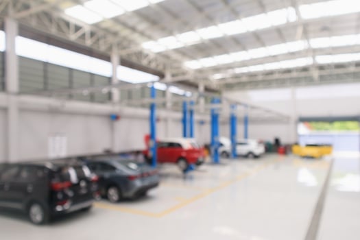 car service centre with auto at repair station bokeh light defocused blur background photo