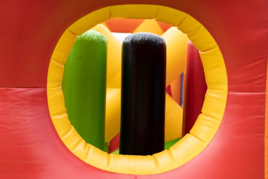 Obstacle course is red. Inflatable amusement park. Attraction for children. photo