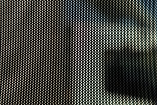 Film on glass of mesh texture. Advertising film from inside interior of bus. photo