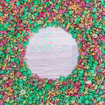 Dry cat food on wooden background photo