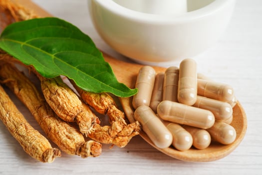 Ginseng roots and green leaf, healthy food. photo