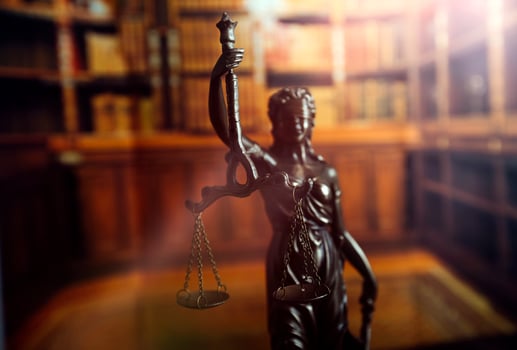 Business and lawyers discussing contract papers with brass scale on desk in office. Law, legal services, advice, justice and law concept picture with film grain effect photo