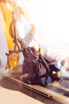 Business and lawyers discussing contract papers with brass scale on desk in office. Law, legal services, advice, justice and law concept picture with film grain effect photo