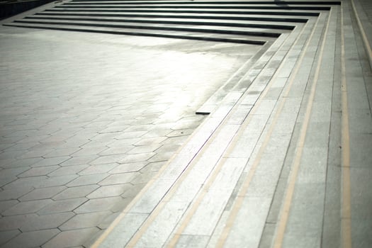 Long stone steps in city. Details of urban environment. photo