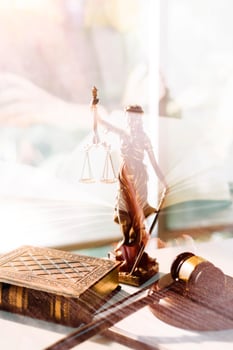 justice and law concept.Male judge in a courtroom on wooden table and Counselor or Male lawyer working in office. Legal law, advice and justice concept. photo