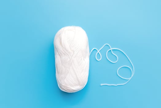 Skeins of wool yarn and knitting needles photo