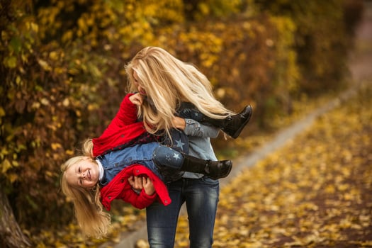 Mother with daughter in autumn park photo