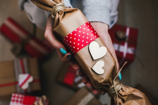 The girl holds in hands charming gift for her loved one photo