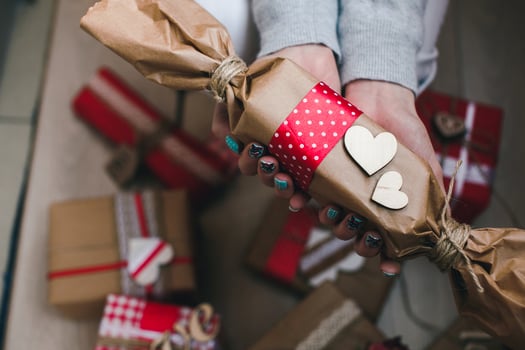 The girl holds in hands charming gift for her loved one photo