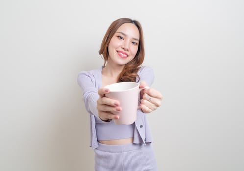 portrait beautiful Asian woman holding coffee cup or mug photo