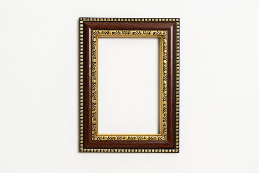 empty picture frame on white wall background photo