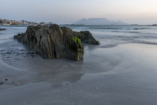 Seascape with rocks in the foreground photo