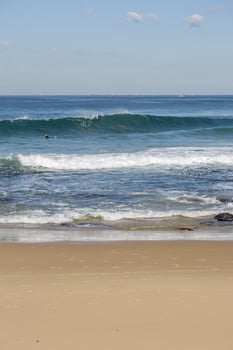 Waves crashing on a beach photo