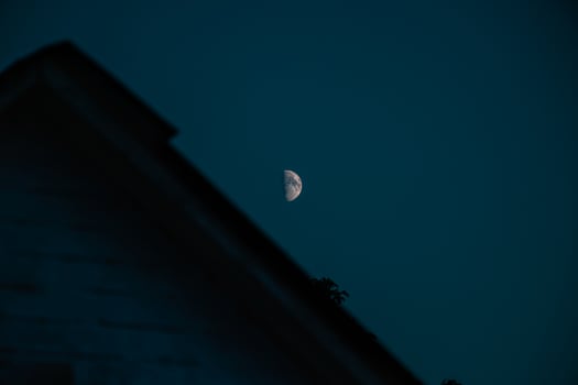 Night in Ukrainian village looks exactly like that. With bright and clear moon and country houses under it photo