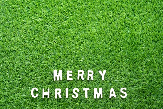 Christmas alphabet on green grass photo