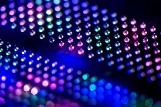 Abstract background with neon light on computer processing equipment photo