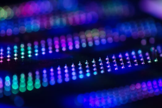 Abstract background with neon light on computer processing equipment photo
