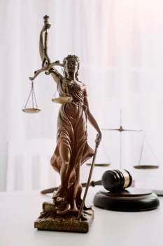 Business and lawyers discussing contract papers with brass scale on desk in office. Law, legal services, advice, justice and law concept picture with film grain effect photo