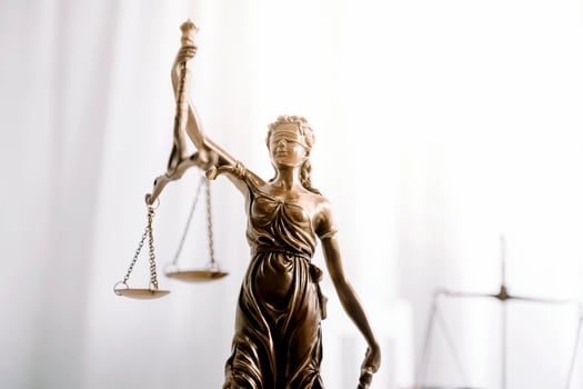 Business and lawyers discussing contract papers with brass scale on desk in office. Law, legal services, advice, justice and law concept picture with film grain effect photo