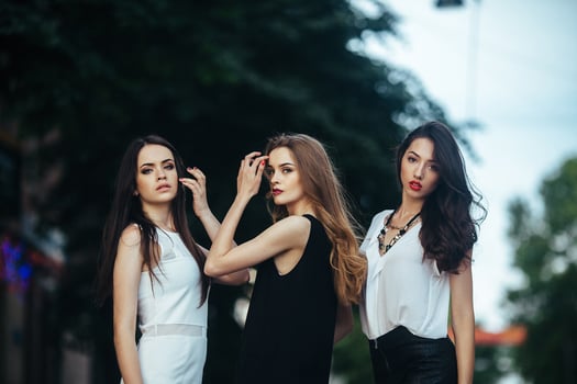 pretty girls posing in a city street photo
