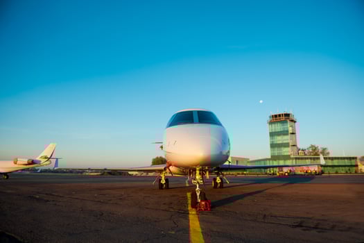 Private airplane. Front view of airplane is landing in airport photo