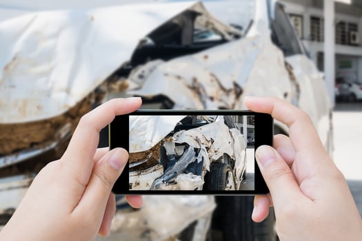 taking photo of the car crash accident damage