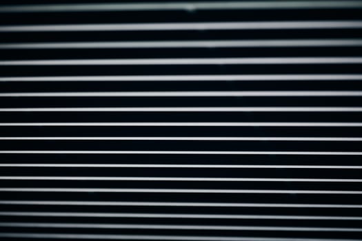 Office grille ceiling. Modern black metal grille ceiling, suspended covering. Abstract design texture. photo