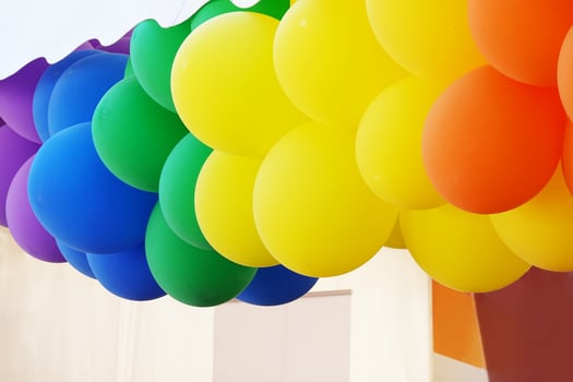 balloons in the colors of the rainbow flag at gay pride month party photo