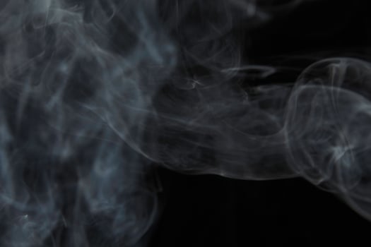 colored smoke isolated on white background photo
