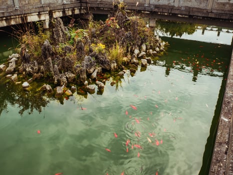 Water Pond and Fish in the water in front of Tianmen Temple on Tianmen mountain at Zhangjiajie China.Tianmen mountain the travel landmark of Hunan zhangjiajie city China photo