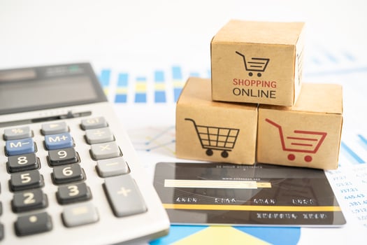Shopping online box with credit card and calculator on graph. Finance commerce import export business concept. photo