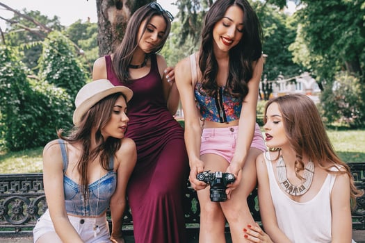 four beautiful young girls consider the camera photo
