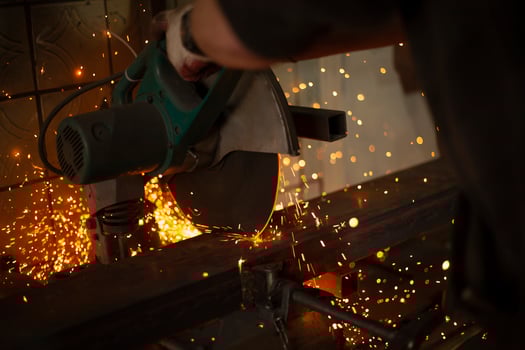 Sawing steel. Circular saw and sparks. Production details. Metal cutting. photo